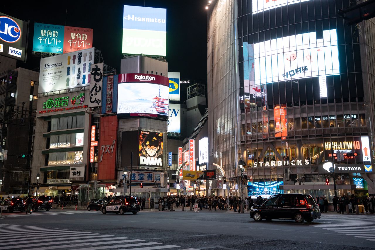Explore the bustling nightlife at Shibuya Crossing, Tokyo, with neon lights and vibrant atmospheres.